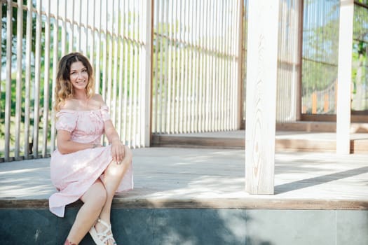 woman near a wooden lattice on a walk