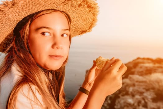 Portrait of young beautiful girl eating corn. Snacking on the sea