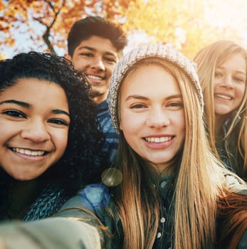 Selfie, happy or portrait of friends in park for social media, online post or profile picture in autumn. Woman, man or gen z people with smile for photo for a fun holiday vacation to relax in nature.