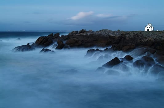 Long exposure of a rock formation in Brittany (France) at the blue hour