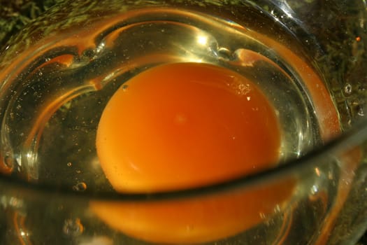 Cracked egg in a jar