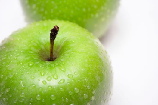 two green wet apples