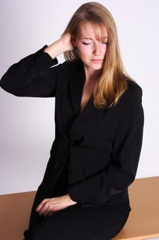 a woman sitting hair grazing on the desk