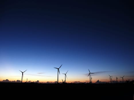 Wind turbines at sunset