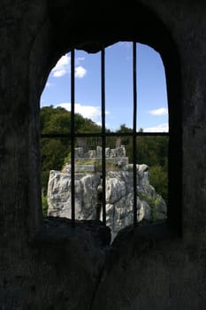 View through a barred window on a rock of the Externsteine