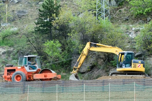 Road roller and excavator