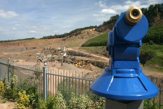 Coin-operated telescope at a vantage point above a quarry in Steinbergen