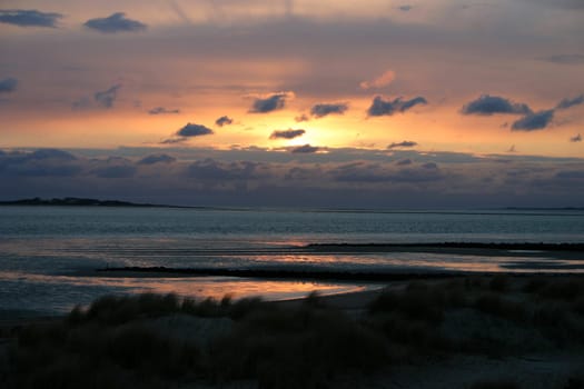 Sunset with clouds over the island of Föhr.