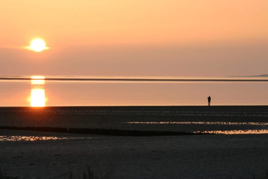 ... at sunset on the island of Föhr at low tide.