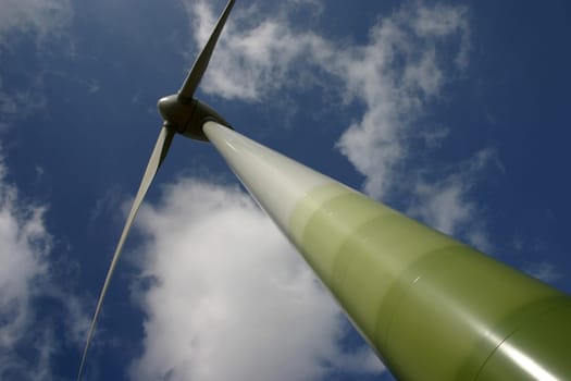 Wind turbine in front of a summer sky