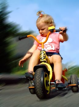 Toddler on tricycle