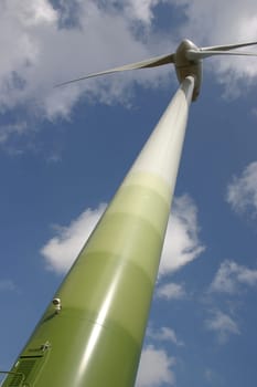 Wind turbine in front of a summer sky