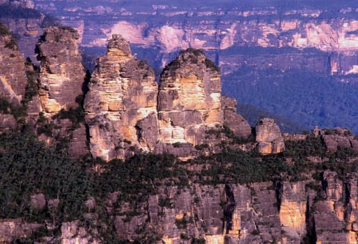 -Scan from slide- The name Blue Mountains comes from evaporating eucalyptus oil. The fine fog causes a blue glow that often lies over the mountains. So,the picture doesn't have a blue cast.