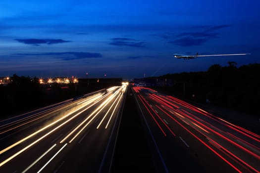 This is a montage,as you have probably seen at first glance: Airplane is at 1/60 secs. affiliated The highway is recorded at 4 secs and separately the tracer from the plane,I don't know the shutter speed anymore