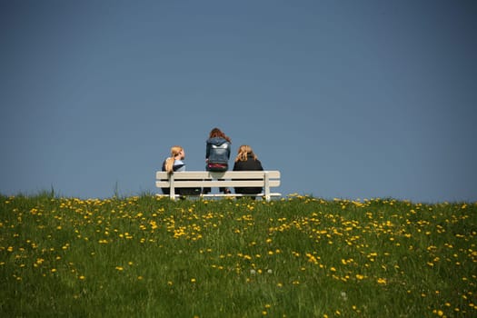 Three young girls on a bench