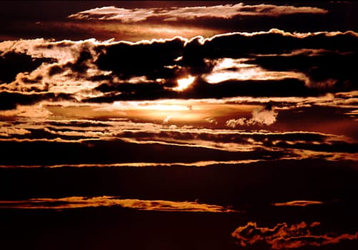 The sun never sets on the longest day of the year at sea level in the Arctic Circle. This picture was taken exactly at midnight,24:00,just a few kilometers from the Arctic Circle. --- scan of the slide---