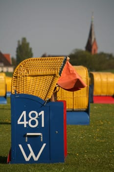 Beach chair on the green beach of Cuxhaven-Grimmershörn