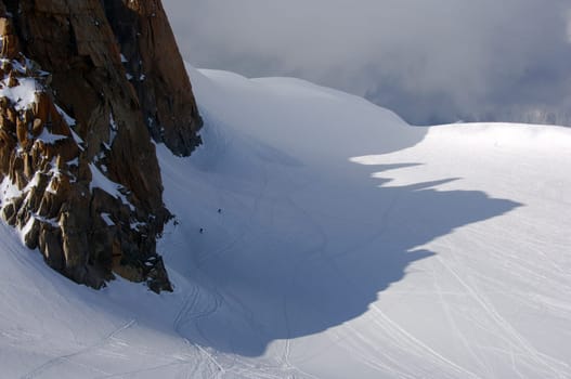 Shadow of the Aiguille du Midi at the bottom of the Vallée Blanche,Chamonix,Savoy Alps,France