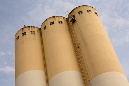 Very tall grain silos of a food factory