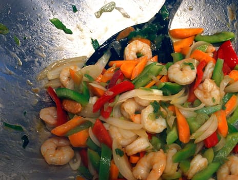 Preparation is the be-all and end-all here. When everything is cut,the vegetables are cooked crisp by stir-frying them briefly in a wok. To do this,taste from shrimp. Served with rice