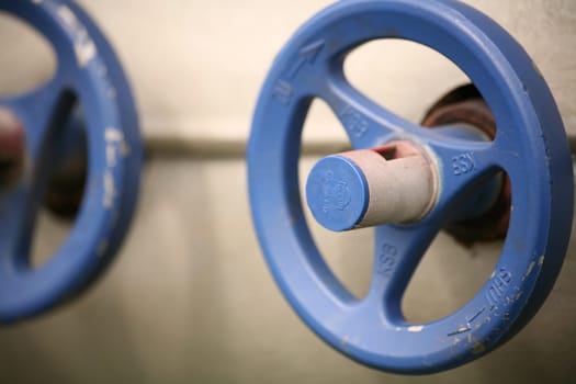 Two blue valve wheels on one machine