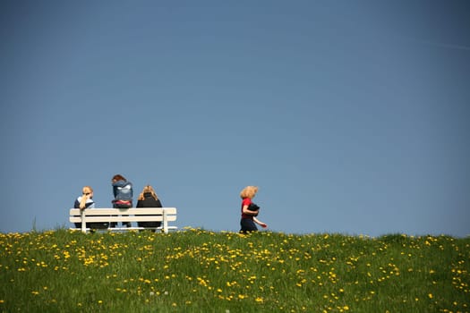 Girl on a bench and a stroller