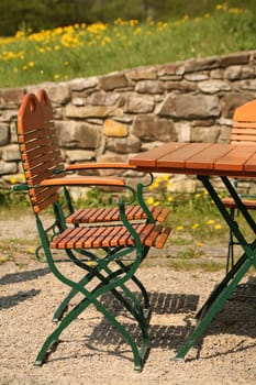 Table and chairs in a garden restaurant