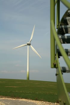 Wind turbine,in the foreground the part of a staircase of another wind turbine