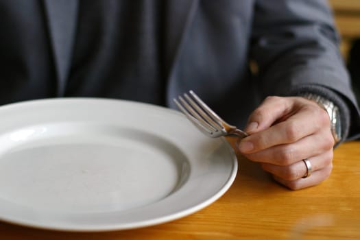 Man with an empty plate