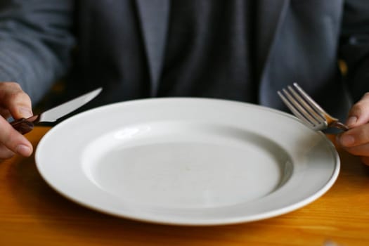 Man with cutlery