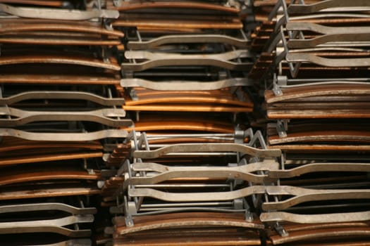 Stack of folded folding chairs