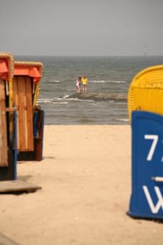 Two girls on a dune in the North Sea off Cuxhaven