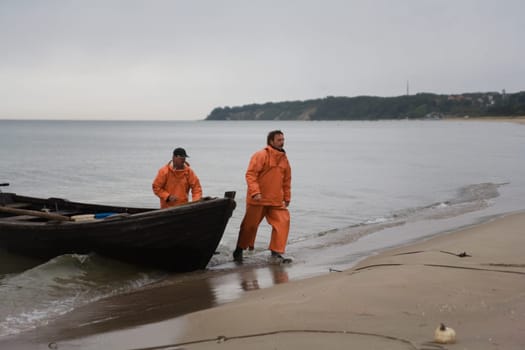 Two fishermen arrived at the beach early in the morning