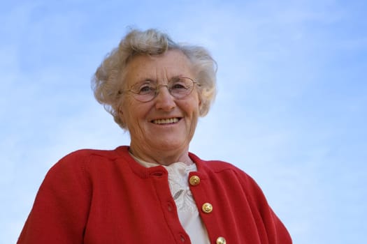 An elderly lady smiling