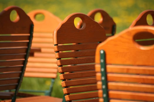 Wooden folding chairs in a garden restaurant
