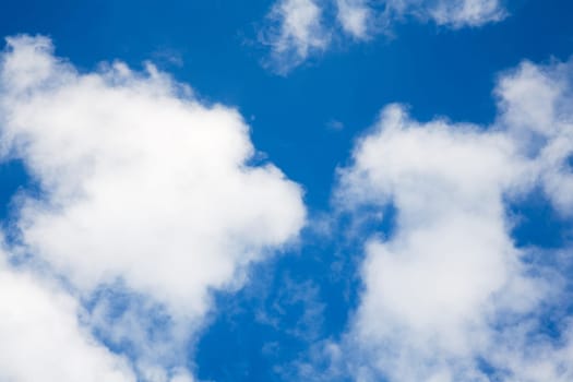 Blue,slightly cloudy sky as background
