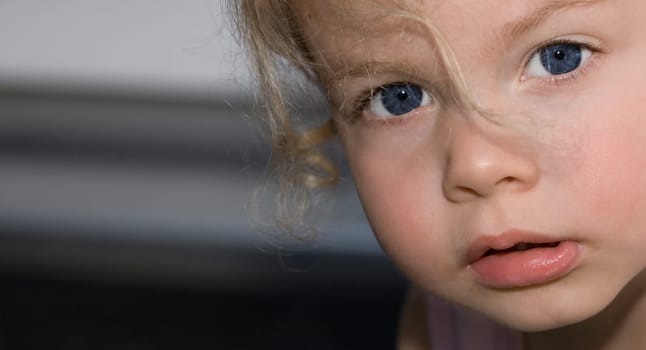 Close-up of a little girl's face on the side of the picture