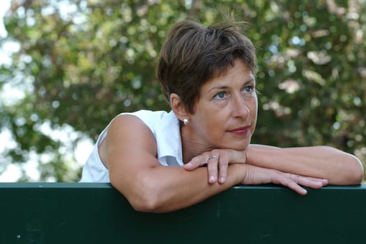 Middle-aged woman on a parbank