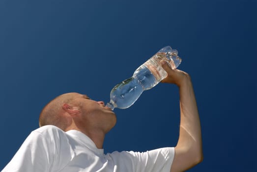 Young man with a bottle of water