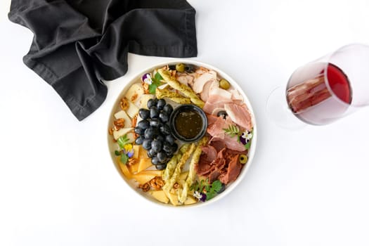 Plate of Mediterranean antipasto snacks. Flat lay, isolated, overhead. High quality photo