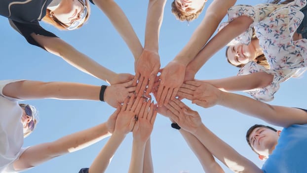 Seven boys and girls join hands as a sign of strong friendship