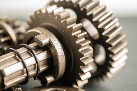 Gear and cogs wheels, clock mechanism, brass metal engine industrial.