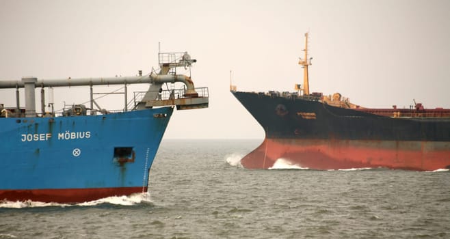 Meeting of the dredging ship Josef Möbius with a cargo ship off Cuxhaven (North Sea)