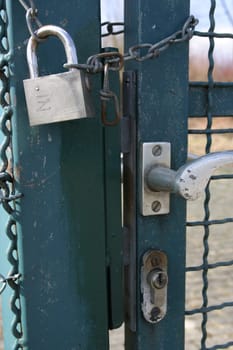 Lattice door barred with chain and lock