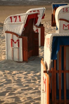 White beach chairs at the North Sea