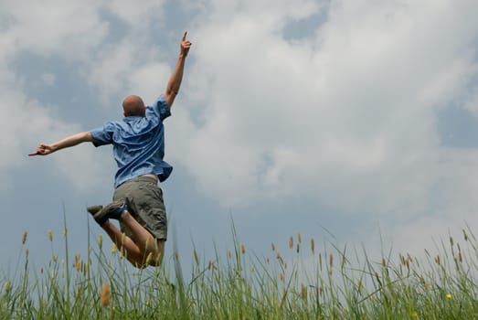 Young man jumping in the air
