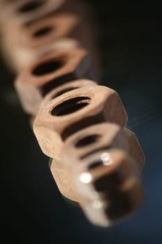 Old,rusted screw nuts on a mirror
