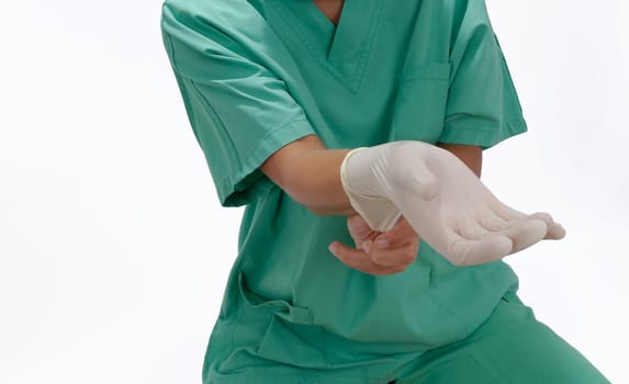 Doctor puts on a glove