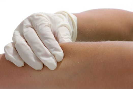 Doctor palpates an arm