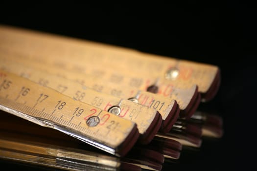 Yellow wooden measuring rod made in Germany